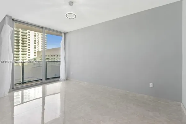 a view of an empty room with a window