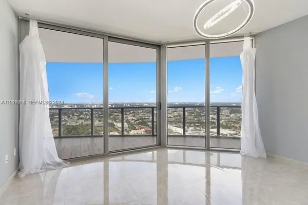 a bathroom with a double vanity sink mirror and shower