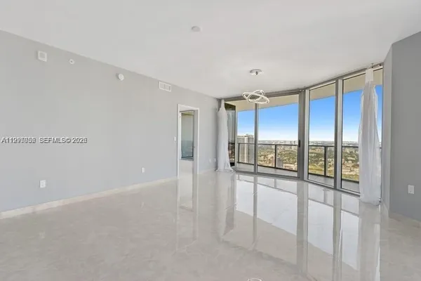 a view of an empty room with a window