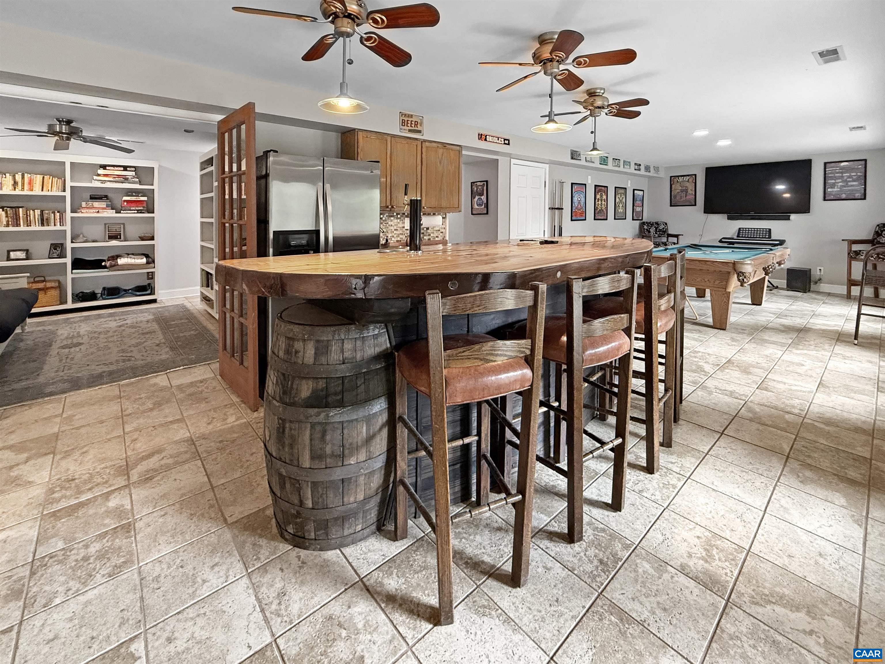1646 Pughs Store Road Afton, VA 22920 - Photo 32 of 52 a kitchen with stainless steel appliances kitchen island granite countertop a table chairs and a refrigerator