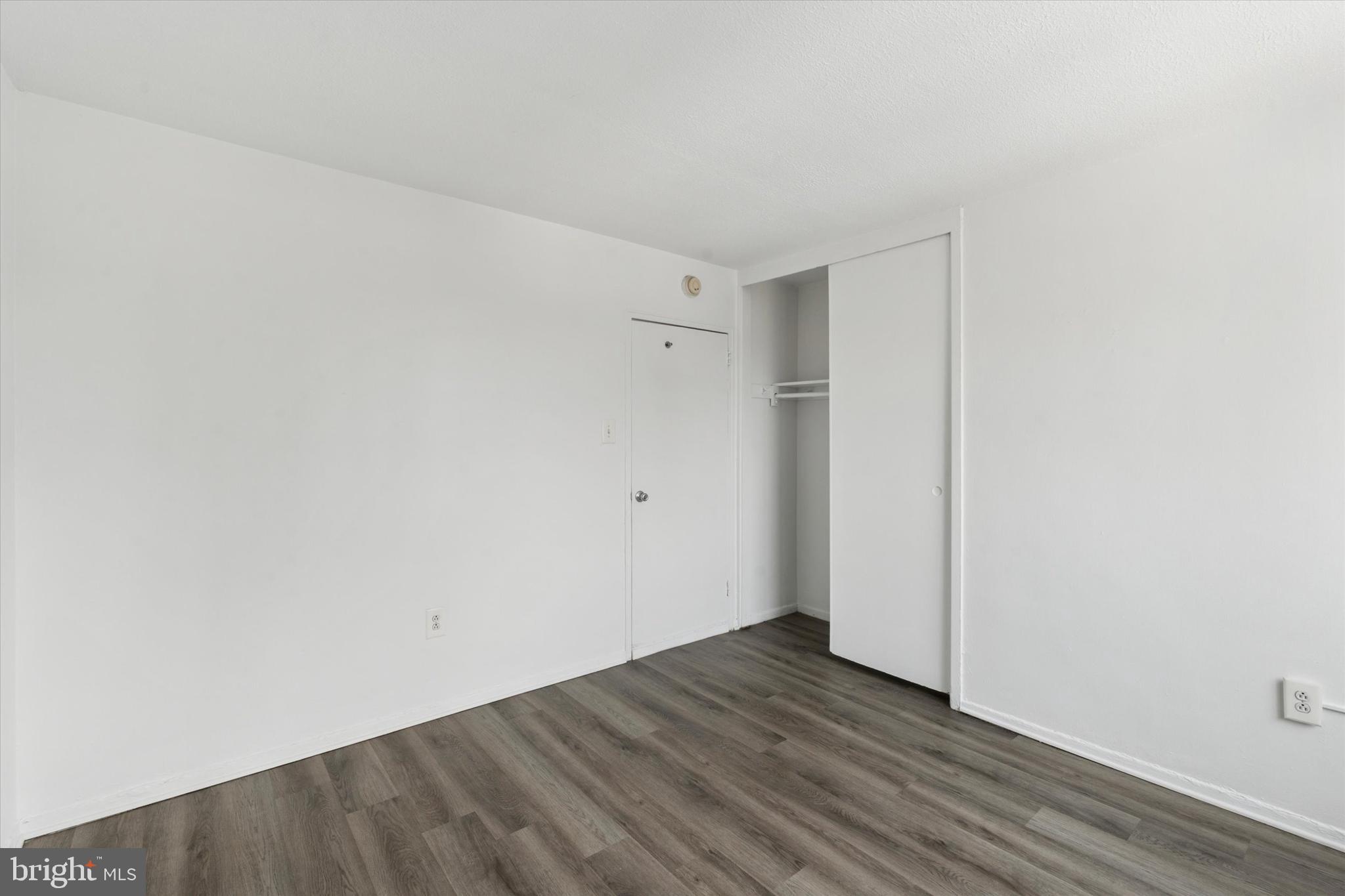 2101 Chestnut Street, Unit 1208 Philadelphia, PA 19103 - Photo 12 of 15 a view of an empty room with wooden floor