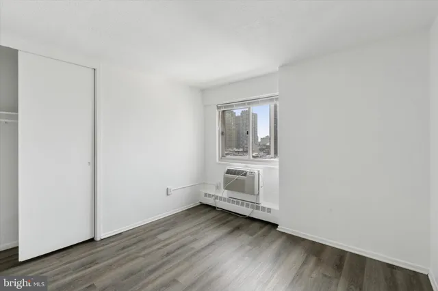 a view of wooden floor and windows in a room