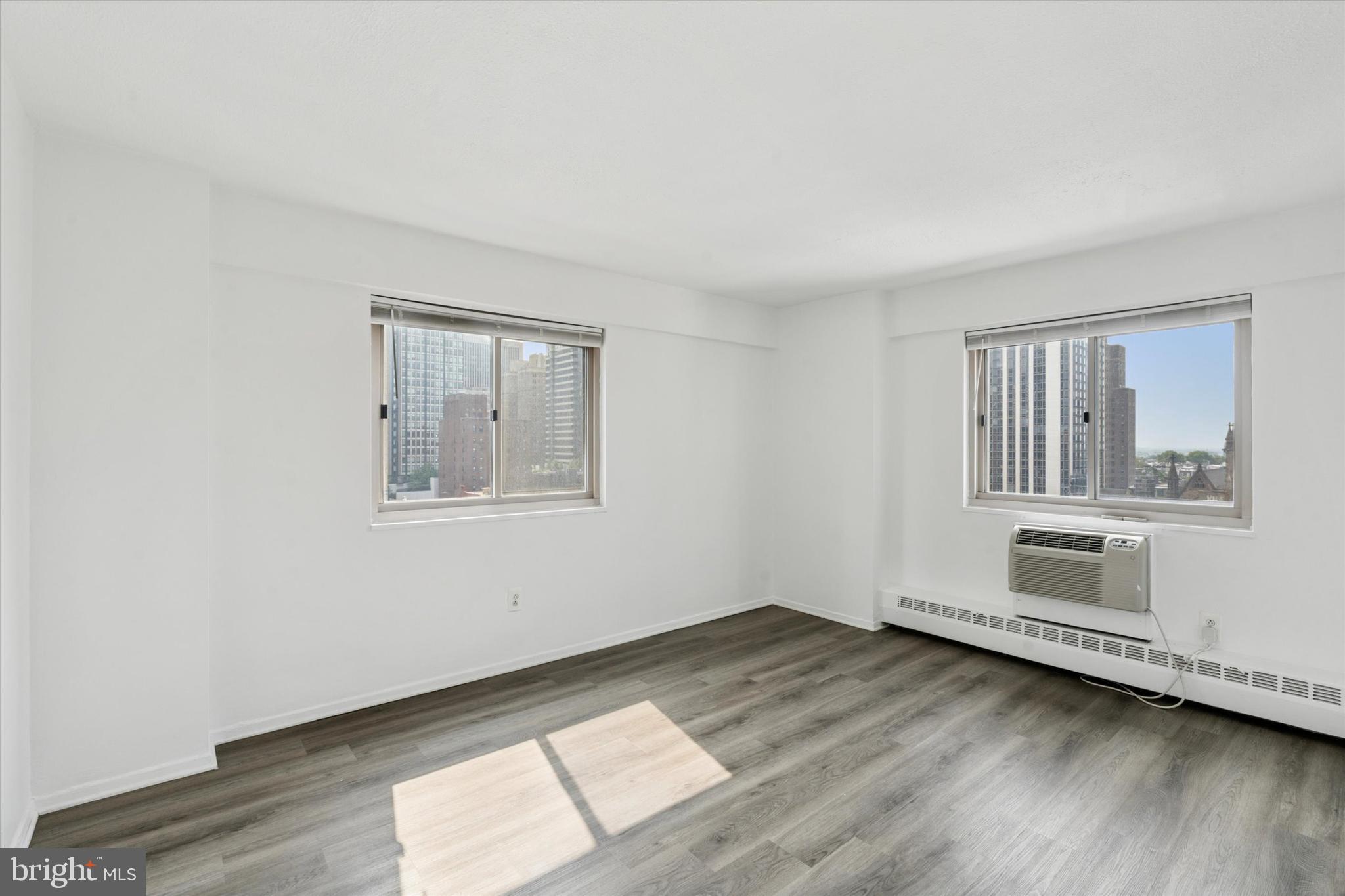 2101 Chestnut Street, Unit 1208 Philadelphia, PA 19103 - Photo 7 of 15 a view of empty room with wooden floor and fan
