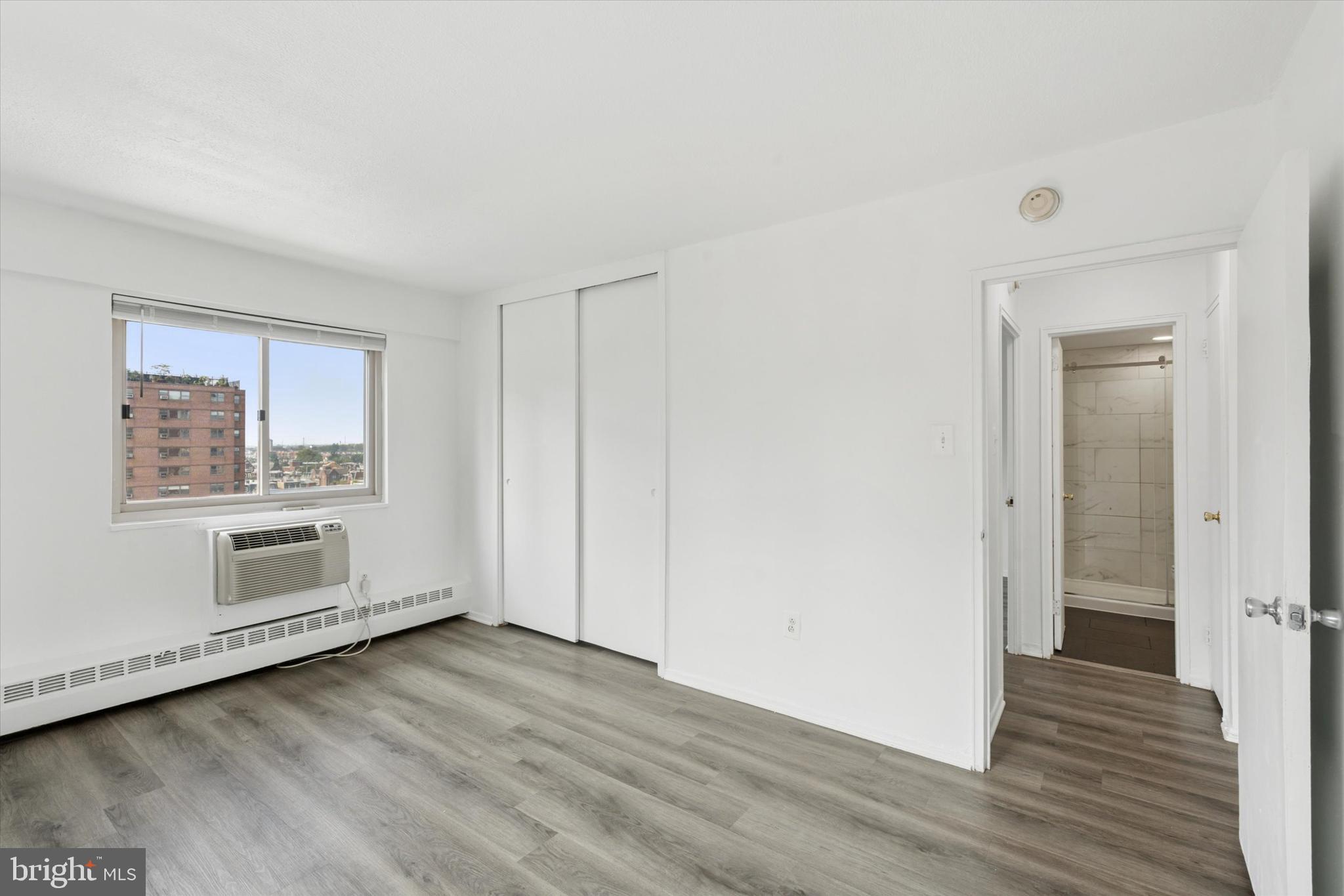 2101 Chestnut Street, Unit 1208 Philadelphia, PA 19103 - Photo 8 of 15 a view of a livingroom with wooden floor and window