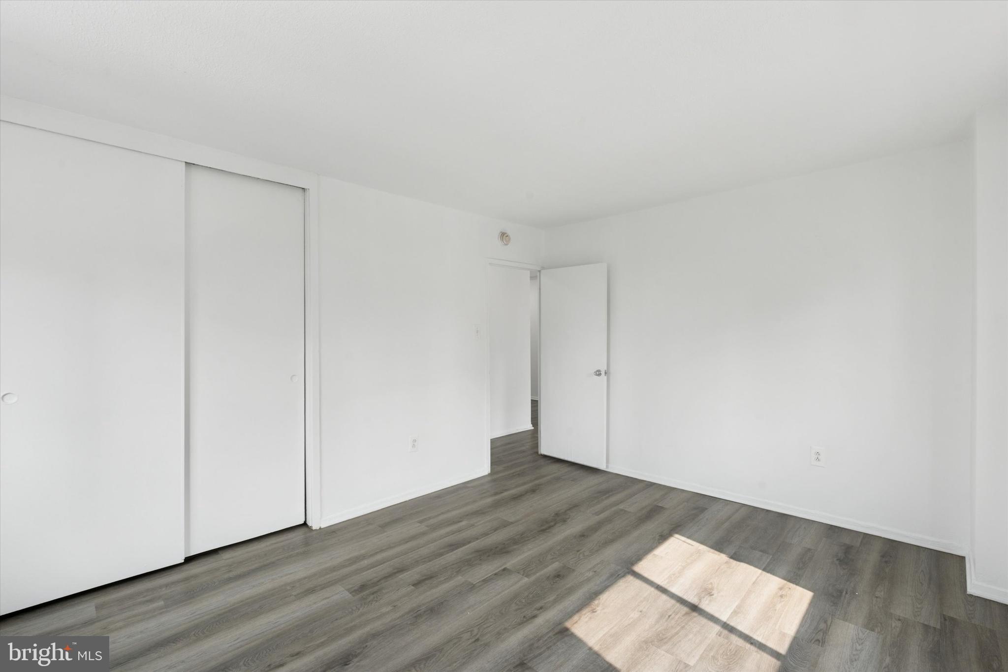 2101 Chestnut Street, Unit 1208 Philadelphia, PA 19103 - Photo 9 of 15 an empty room with wooden floor