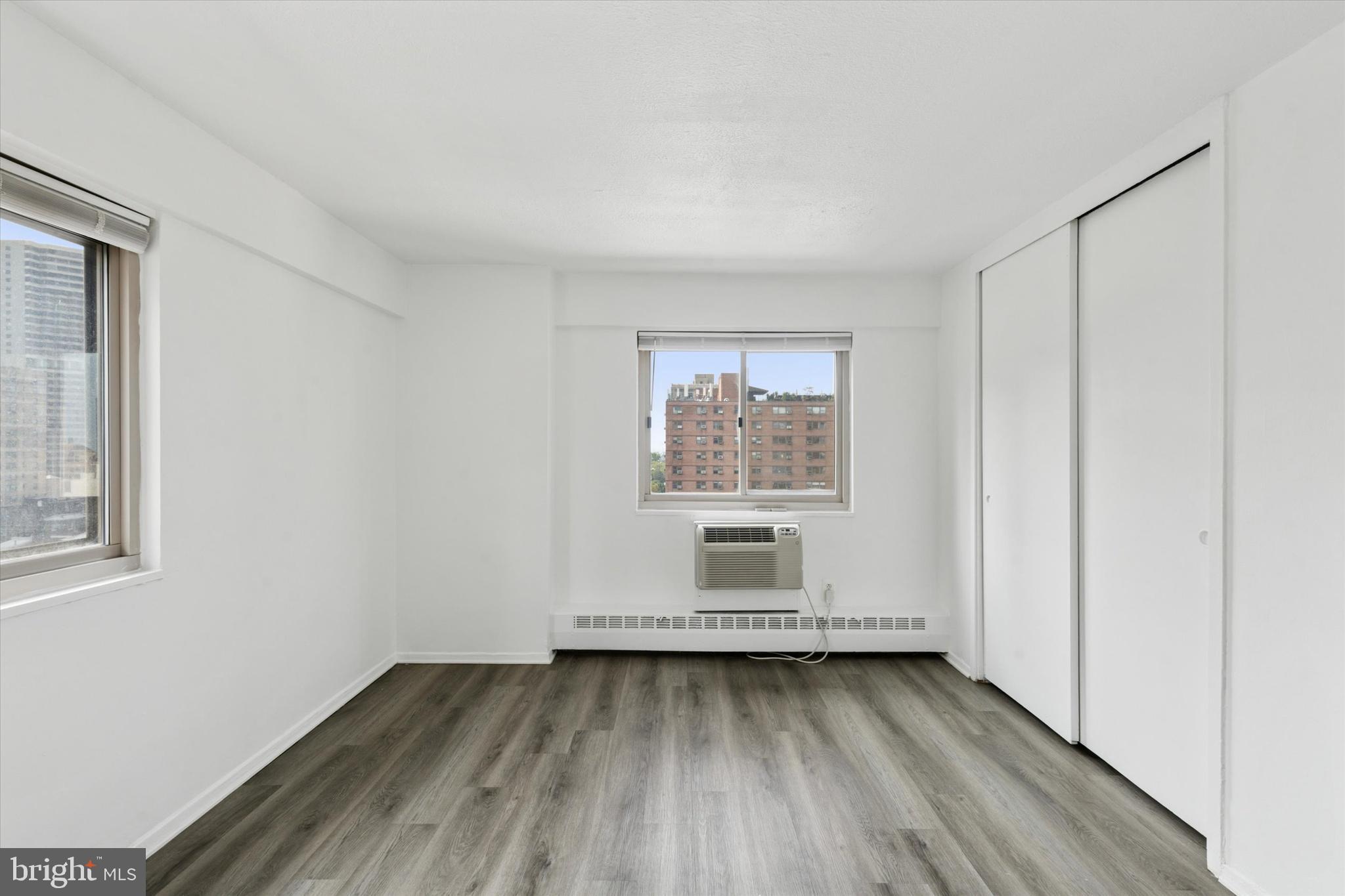 2101 Chestnut Street, Unit 1208 Philadelphia, PA 19103 - Photo 10 of 15 a view of a room with wooden floor and window