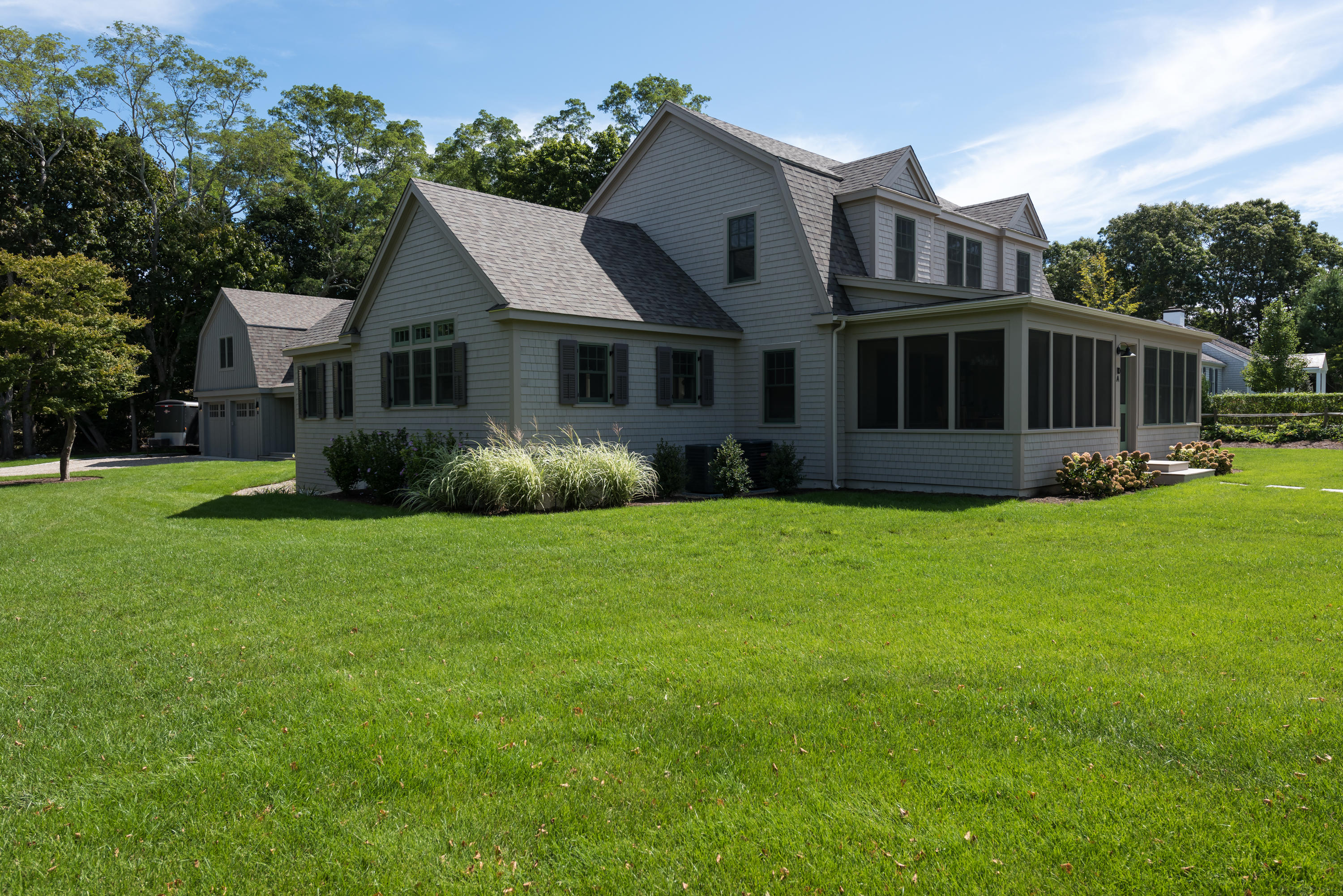 a view of house with yard and green space