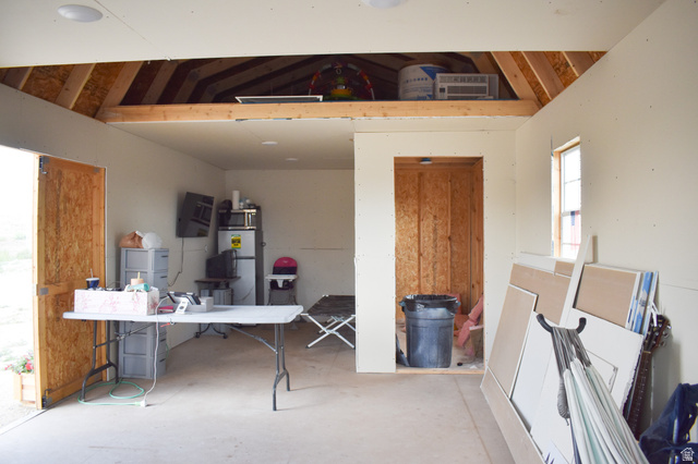 345 North Main Street Clawson, UT 84516 - Photo 17 of 17 Interior space featuring an exposed wood rafter attic storage area, light-colored walls, and a recessed ceiling light fixture