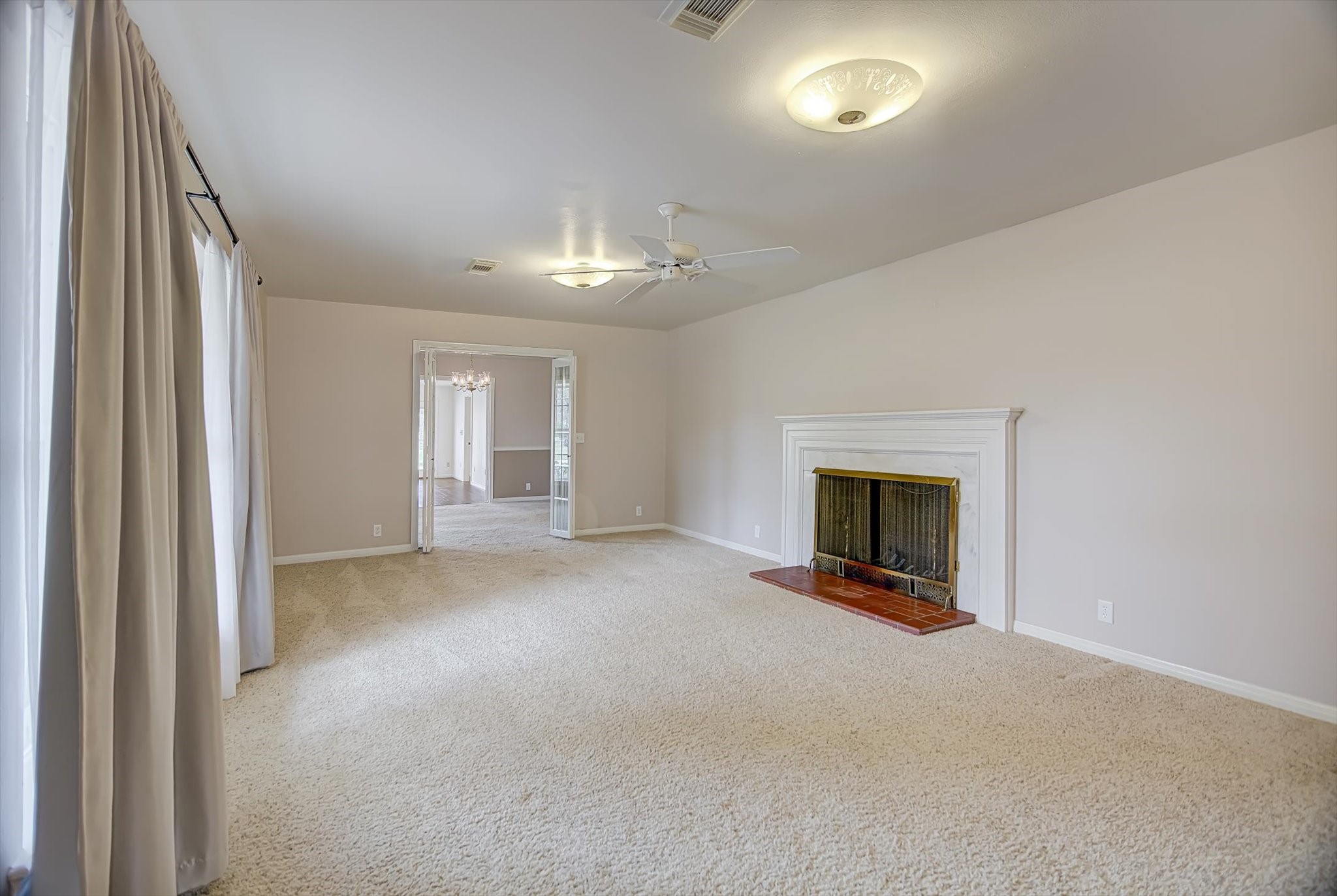 106 Woodland Road Lake Jackson, TX 77566 - Photo 12 of 46 a view of empty room with a fireplace