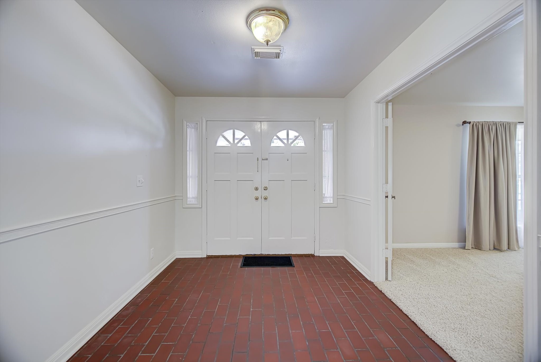 106 Woodland Road Lake Jackson, TX 77566 - Photo 2 of 46 wooden floor in an empty room with a window