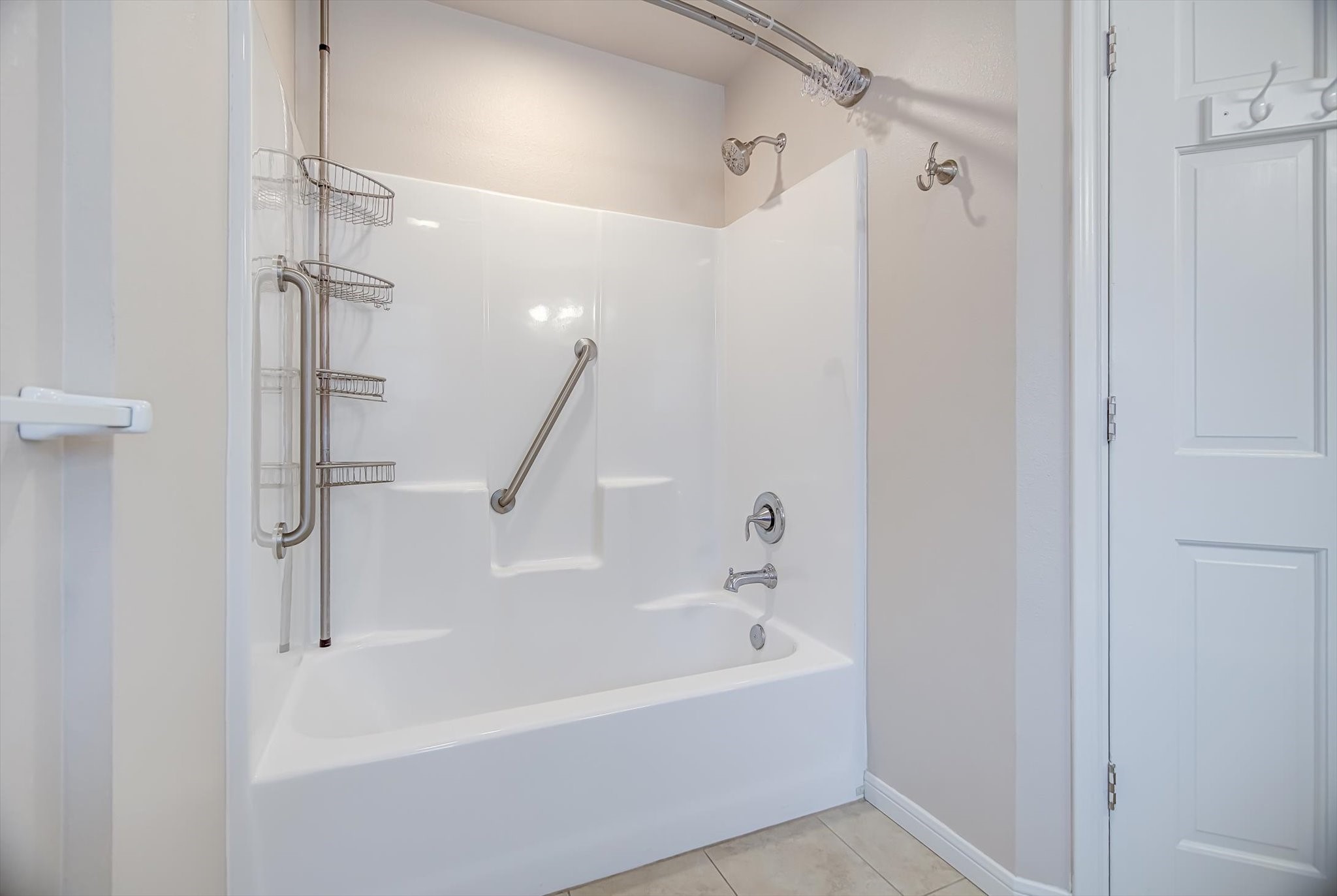 106 Woodland Road Lake Jackson, TX 77566 - Photo 23 of 46 a white bath tub sitting next to a shower