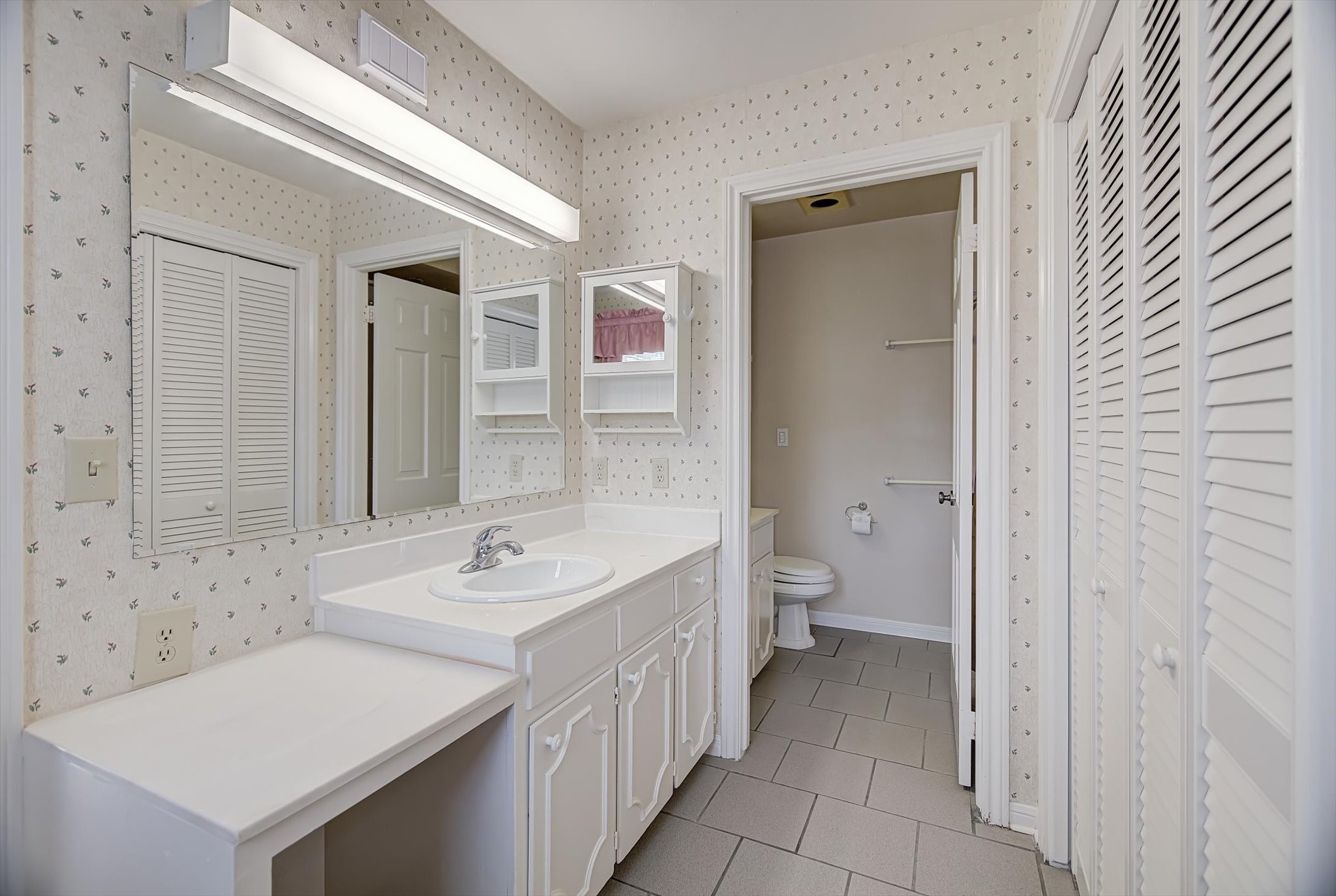 106 Woodland Road Lake Jackson, TX 77566 - Photo 26 of 46 a bathroom with a sink a toilet and shower