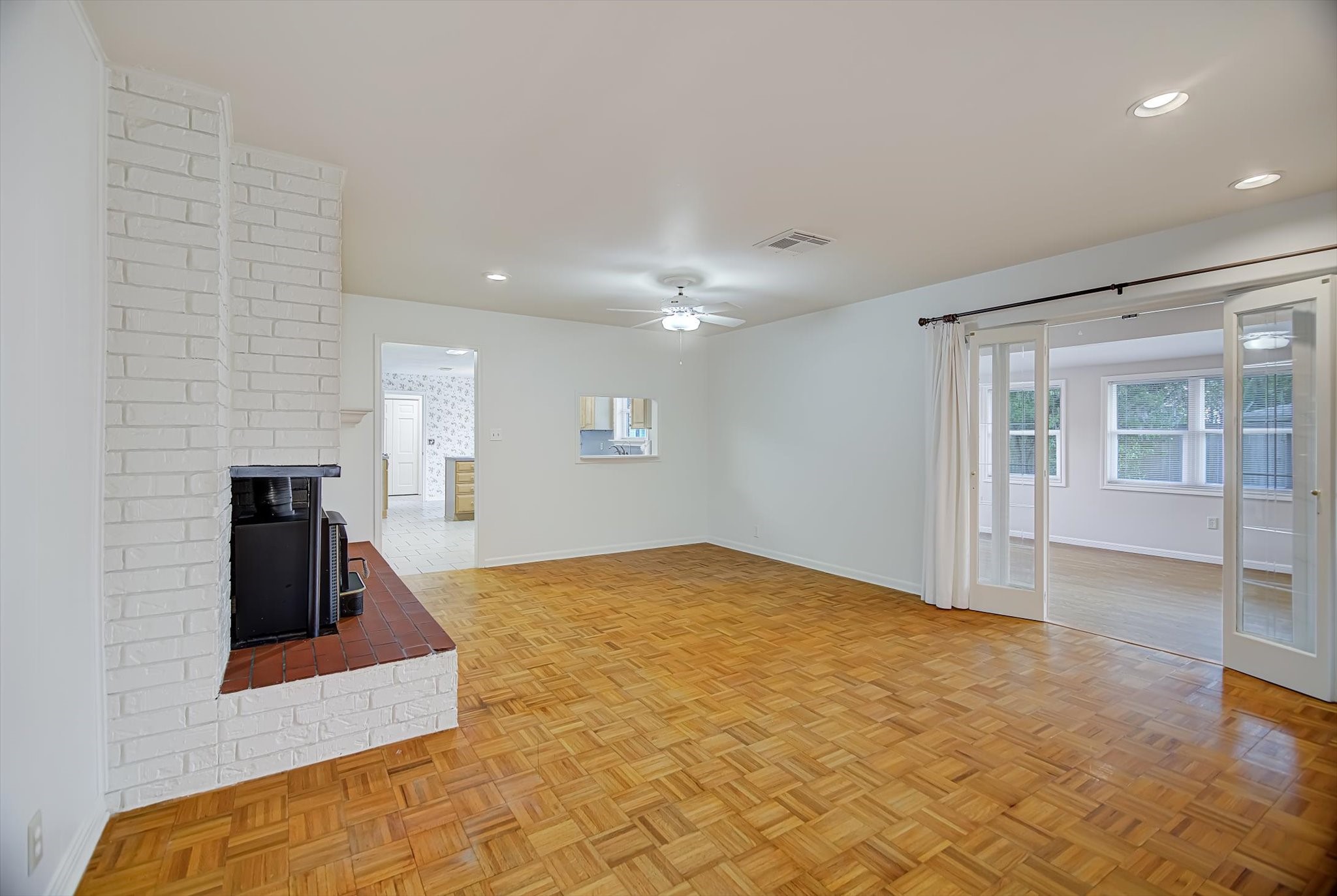 106 Woodland Road Lake Jackson, TX 77566 - Photo 3 of 46 a view of a livingroom with wooden floor and staircase