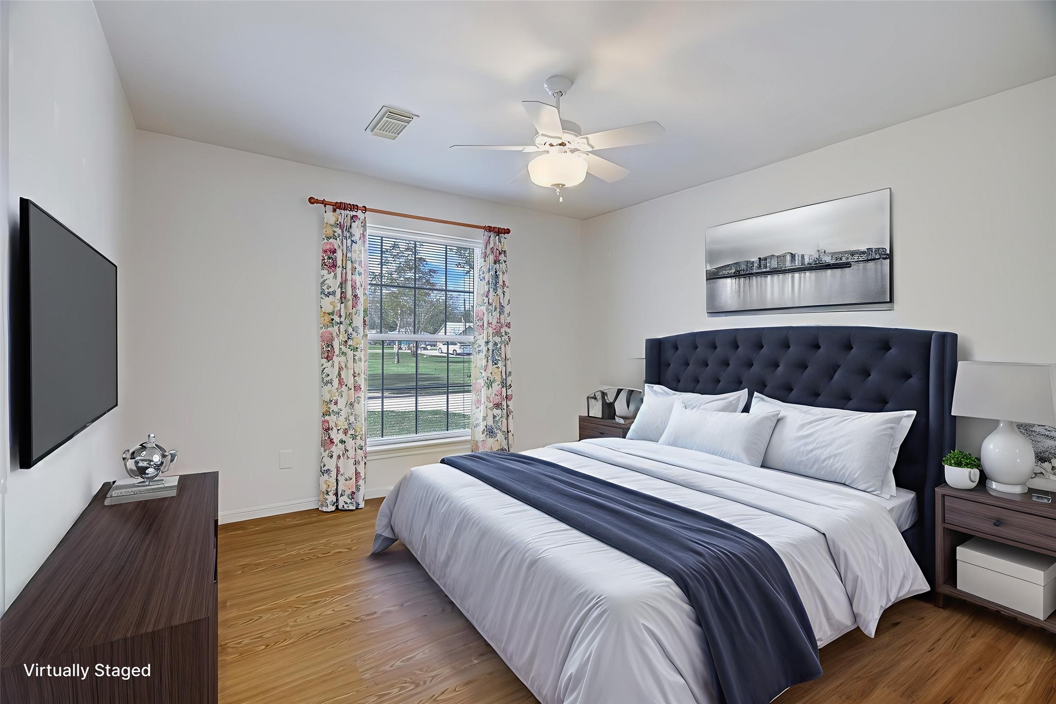 106 Woodland Road Lake Jackson, TX 77566 - Photo 35 of 46 a bedroom with bed tv and table