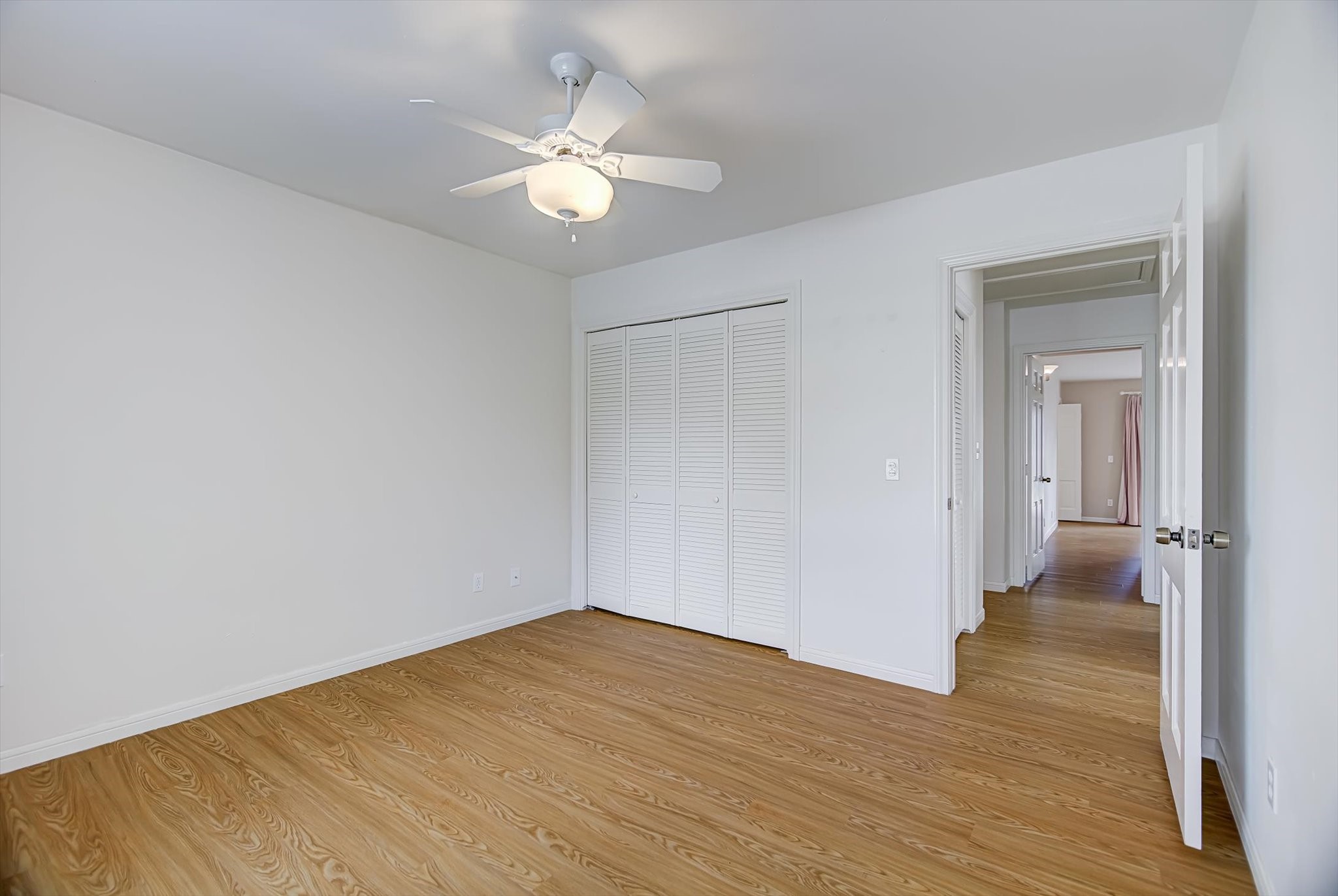 106 Woodland Road Lake Jackson, TX 77566 - Photo 36 of 46 a view of a room with wooden floor and white walls