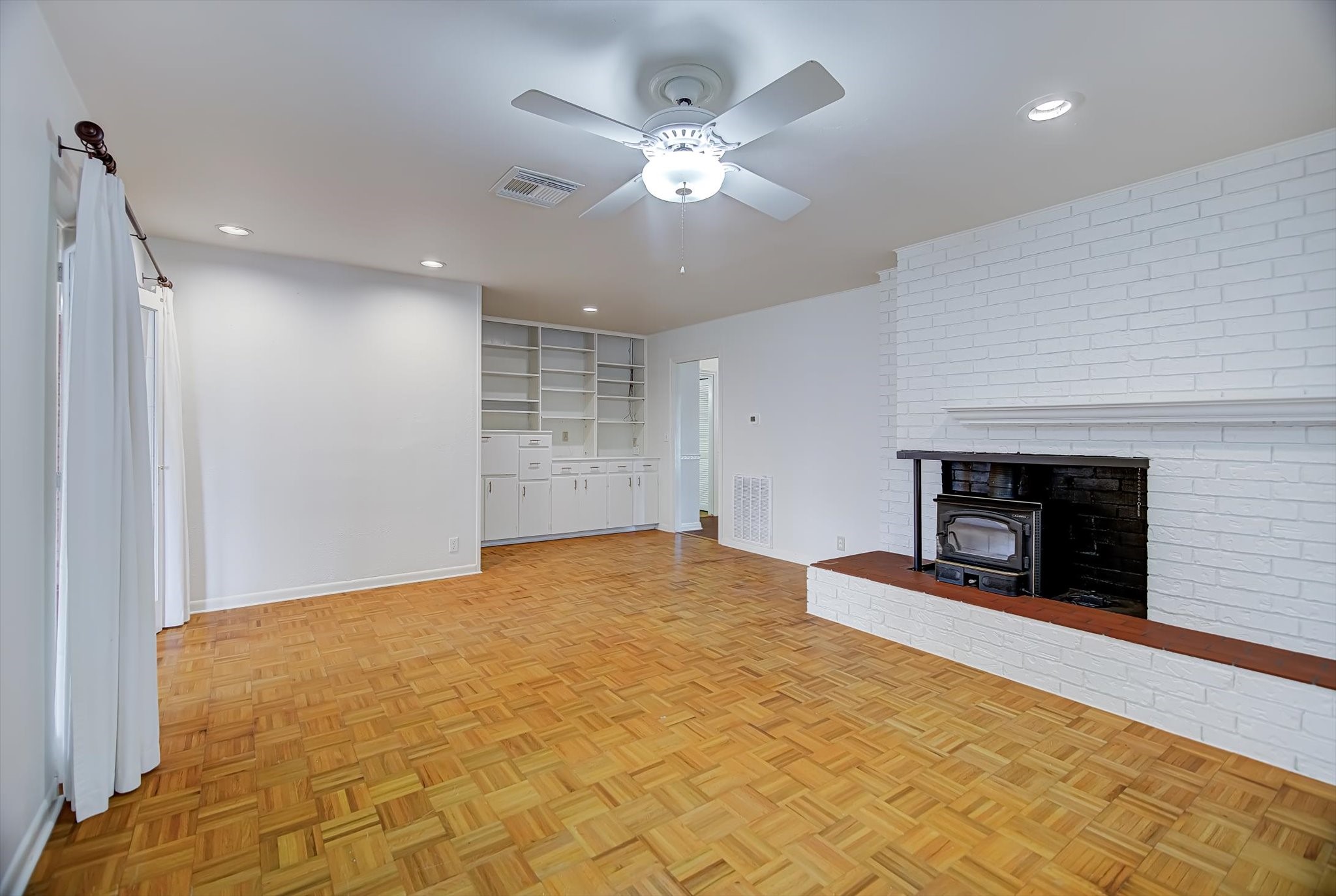 106 Woodland Road Lake Jackson, TX 77566 - Photo 4 of 46 a view of an empty room with a fireplace