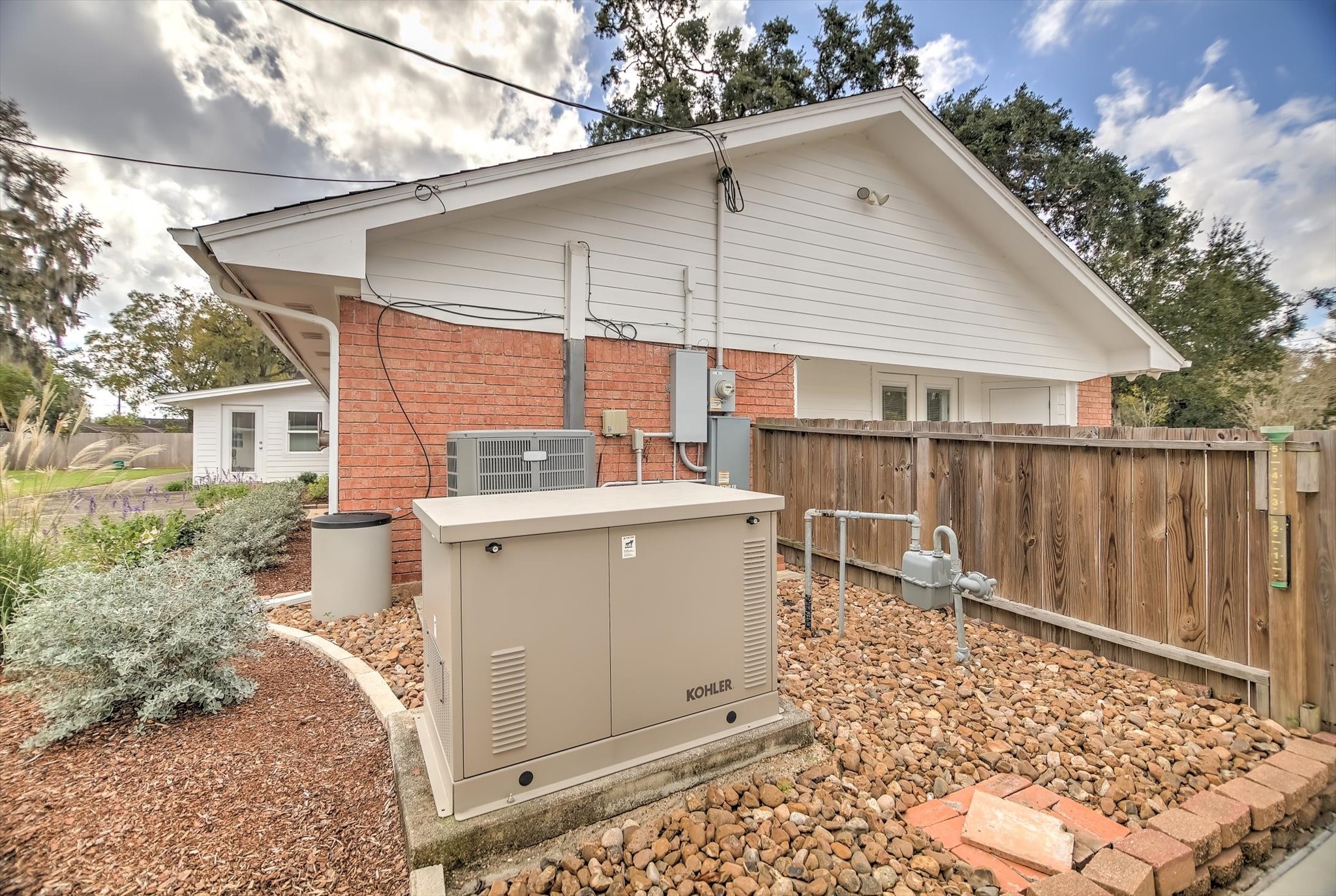 106 Woodland Road Lake Jackson, TX 77566 - Photo 41 of 46 a view of a wooden house with a large window