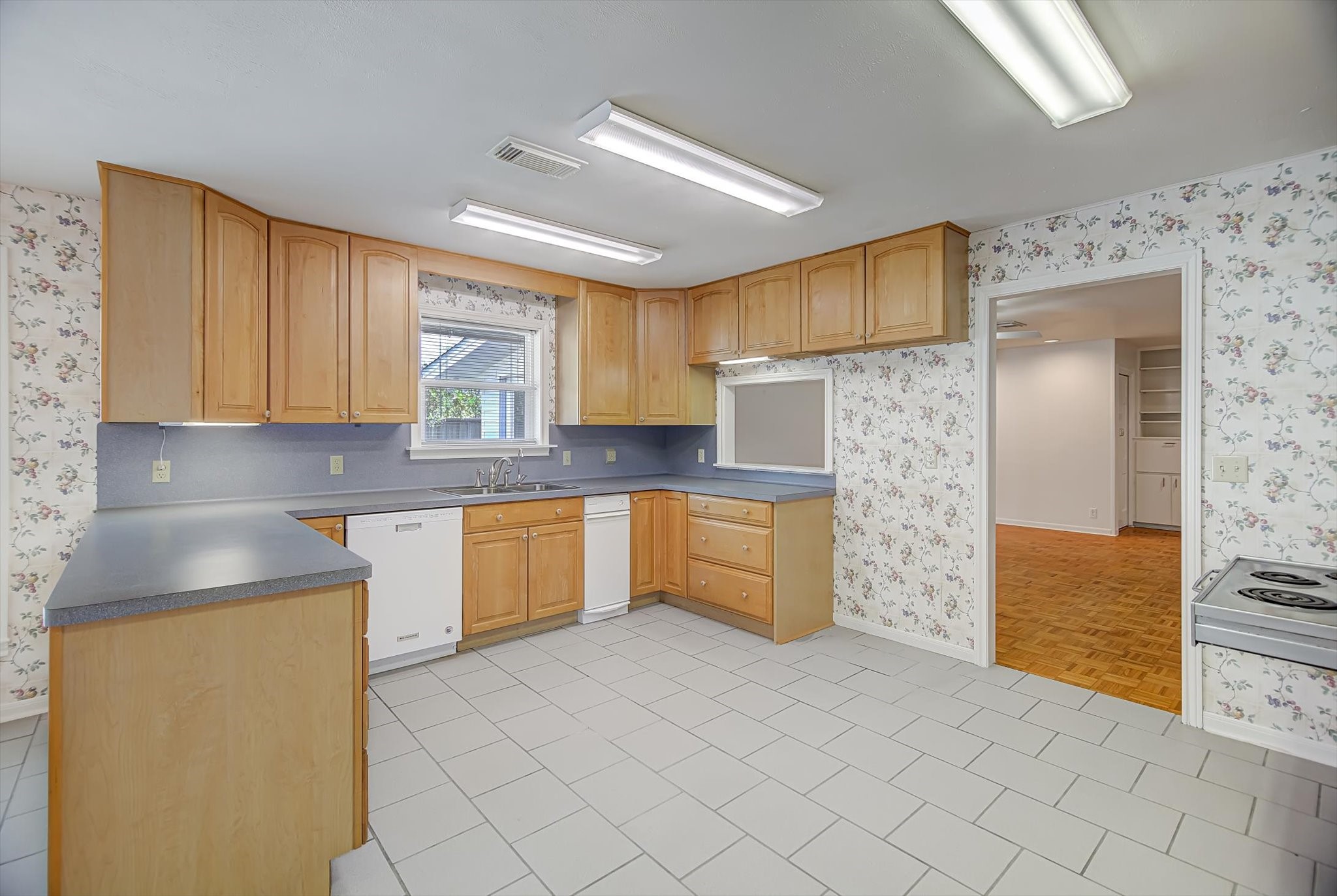 106 Woodland Road Lake Jackson, TX 77566 - Photo 5 of 46 a kitchen with stainless steel appliances granite countertop a stove a sink and a refrigerator