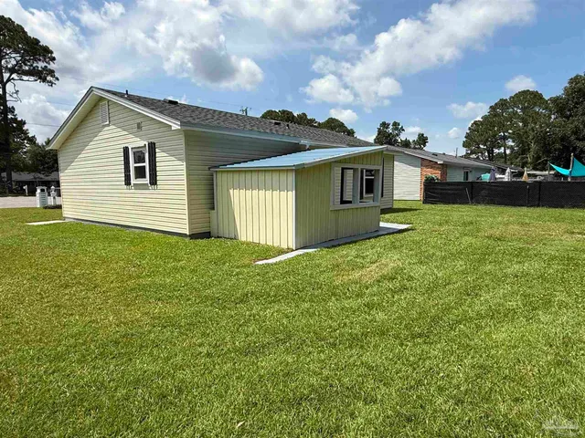 a front view of a house with yard