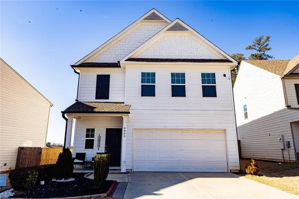 a front view of a house with yard