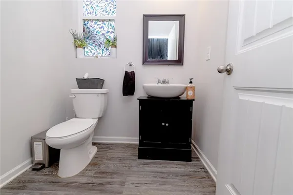 a bathroom with a toilet and a sink