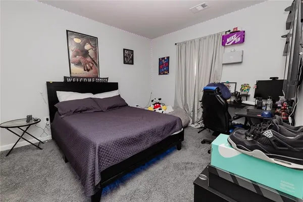 a living room with a couch and a flat screen tv