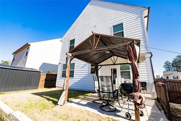 a view of a patio in a backyard