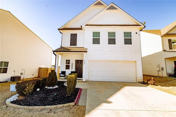 a view of a house with outdoor kitchen