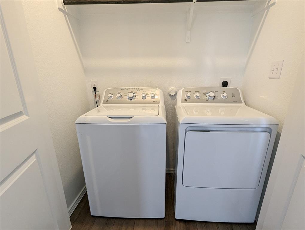 152 Avre Loop Kyle, TX 78640 - Photo 5 of 24 Functional laundry nook provides convenient in-home appliance access with overhead shelving.
