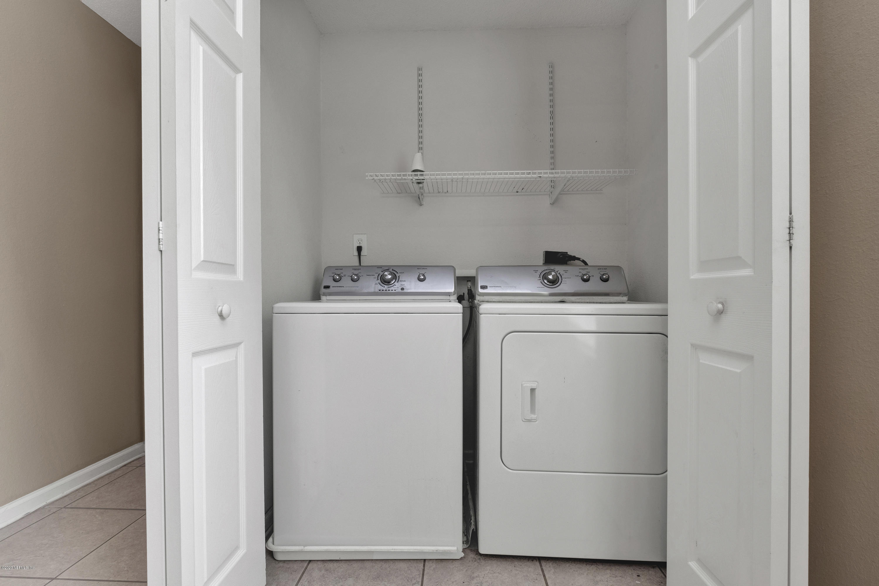 8692 Springtree Road Jacksonville, FL 32210 - Photo 11 of 19 Washer/Dryer inside