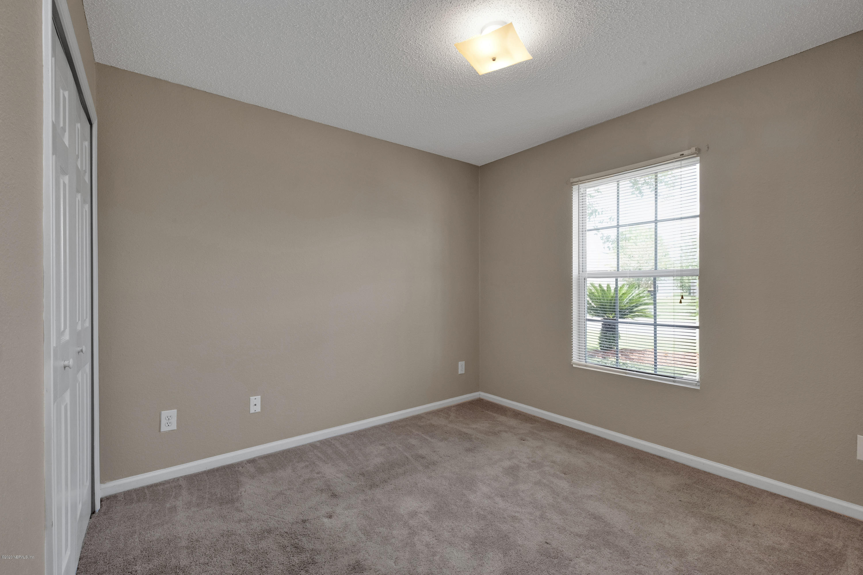 8692 Springtree Road Jacksonville, FL 32210 - Photo 18 of 19 Bedroom 3