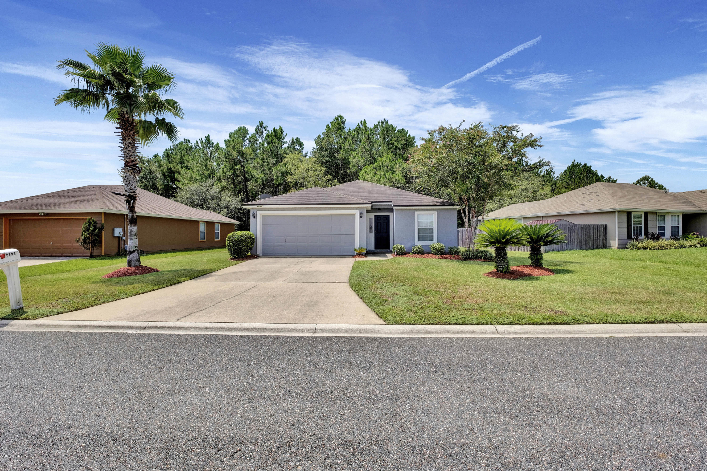 8692 Springtree Road Jacksonville, FL 32210 - Photo 2 of 19 2 car attached garage