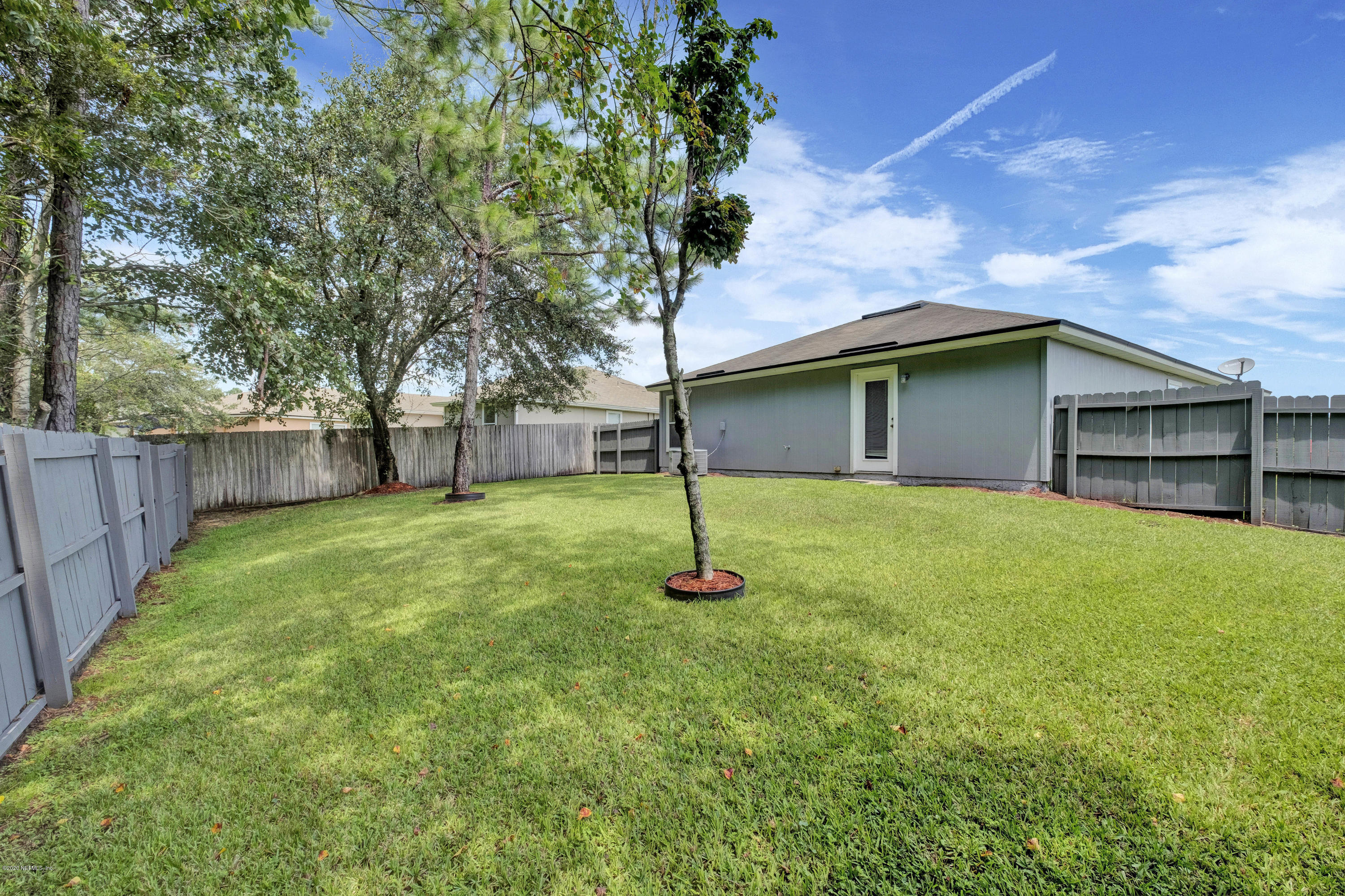 8692 Springtree Road Jacksonville, FL 32210 - Photo 3 of 19 Fully fenced back yard