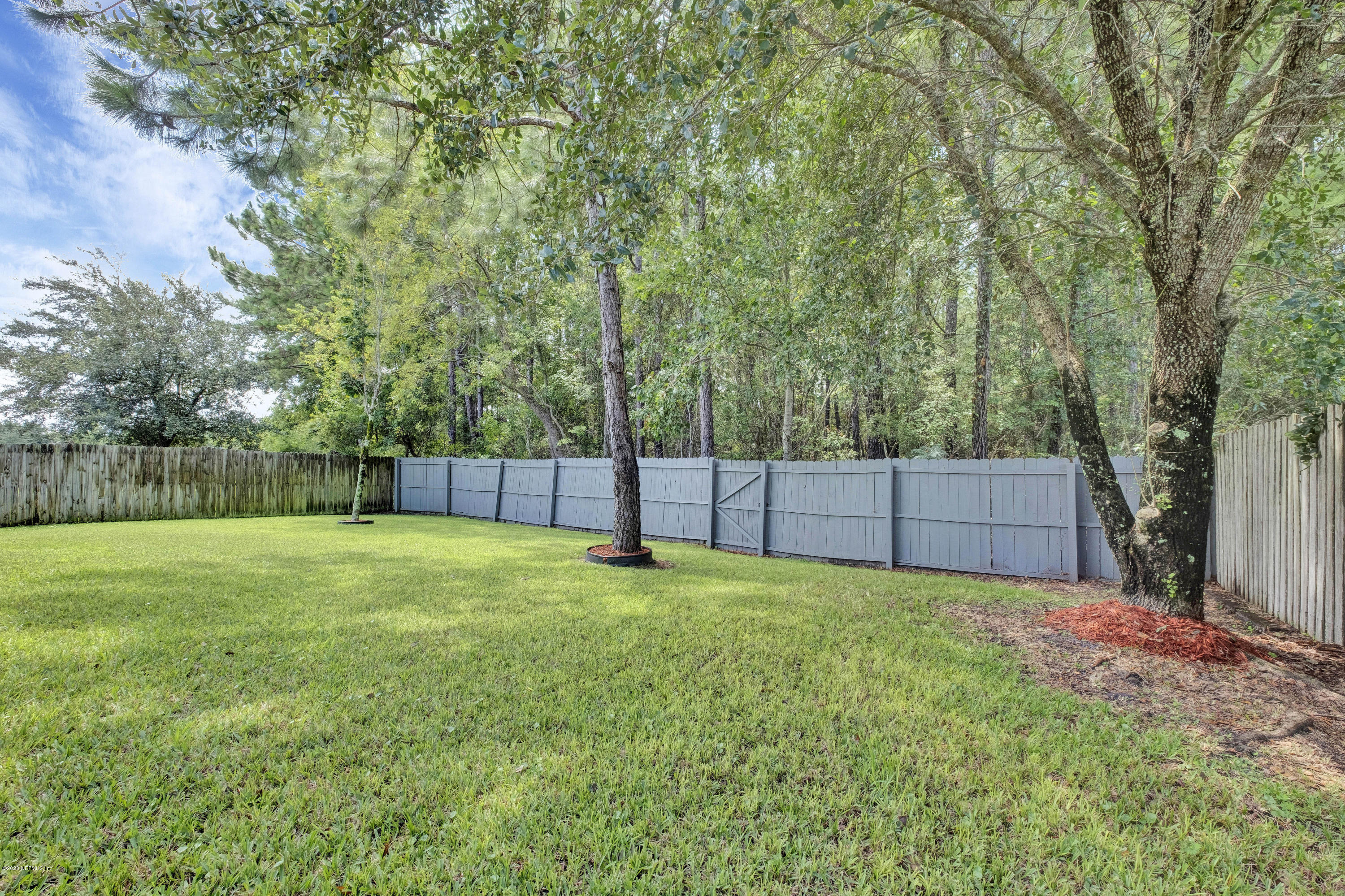 8692 Springtree Road Jacksonville, FL 32210 - Photo 4 of 19 Fully fenced yard on preserve lot