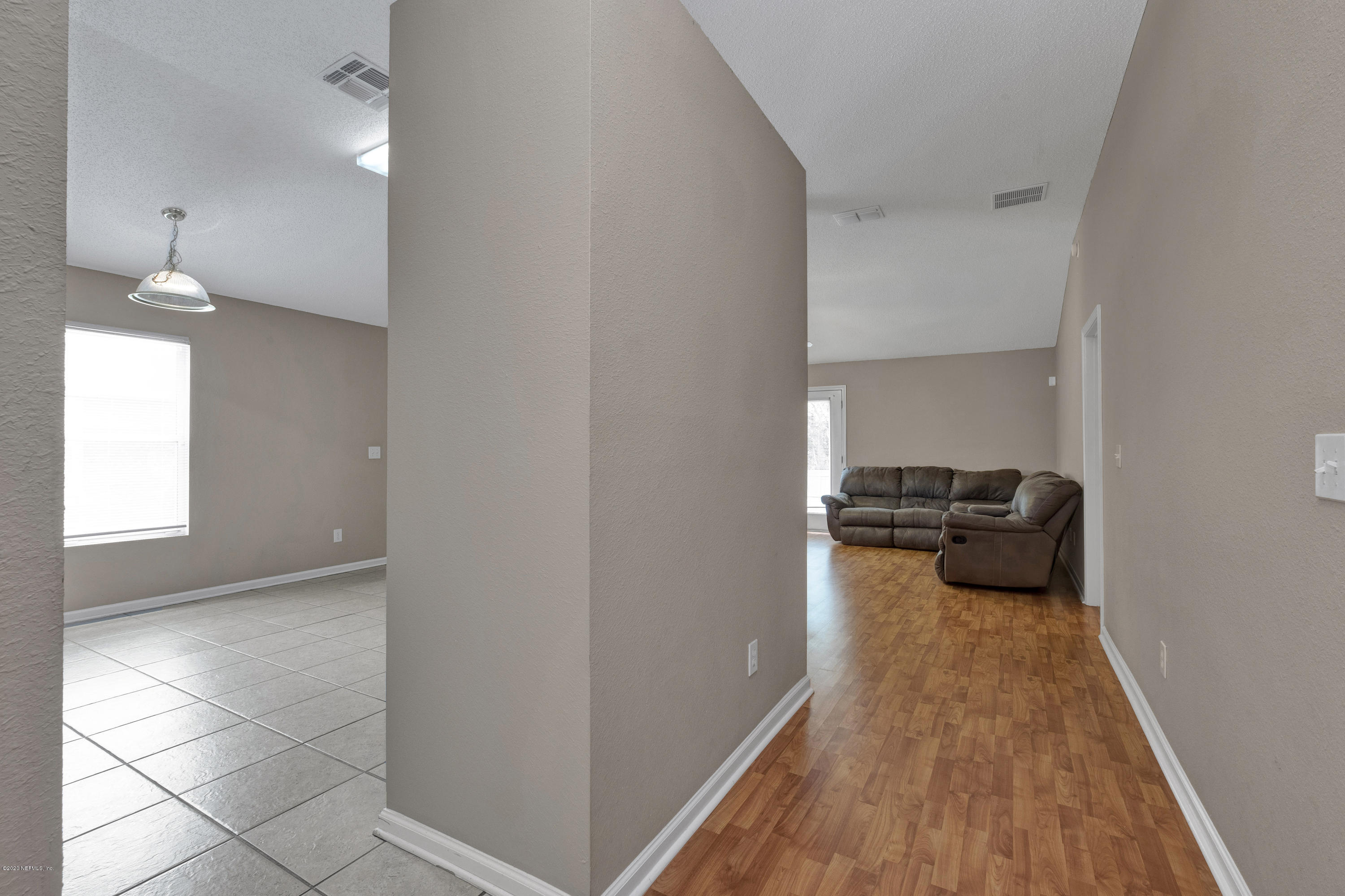 8692 Springtree Road Jacksonville, FL 32210 - Photo 7 of 19 Laminate in Main area