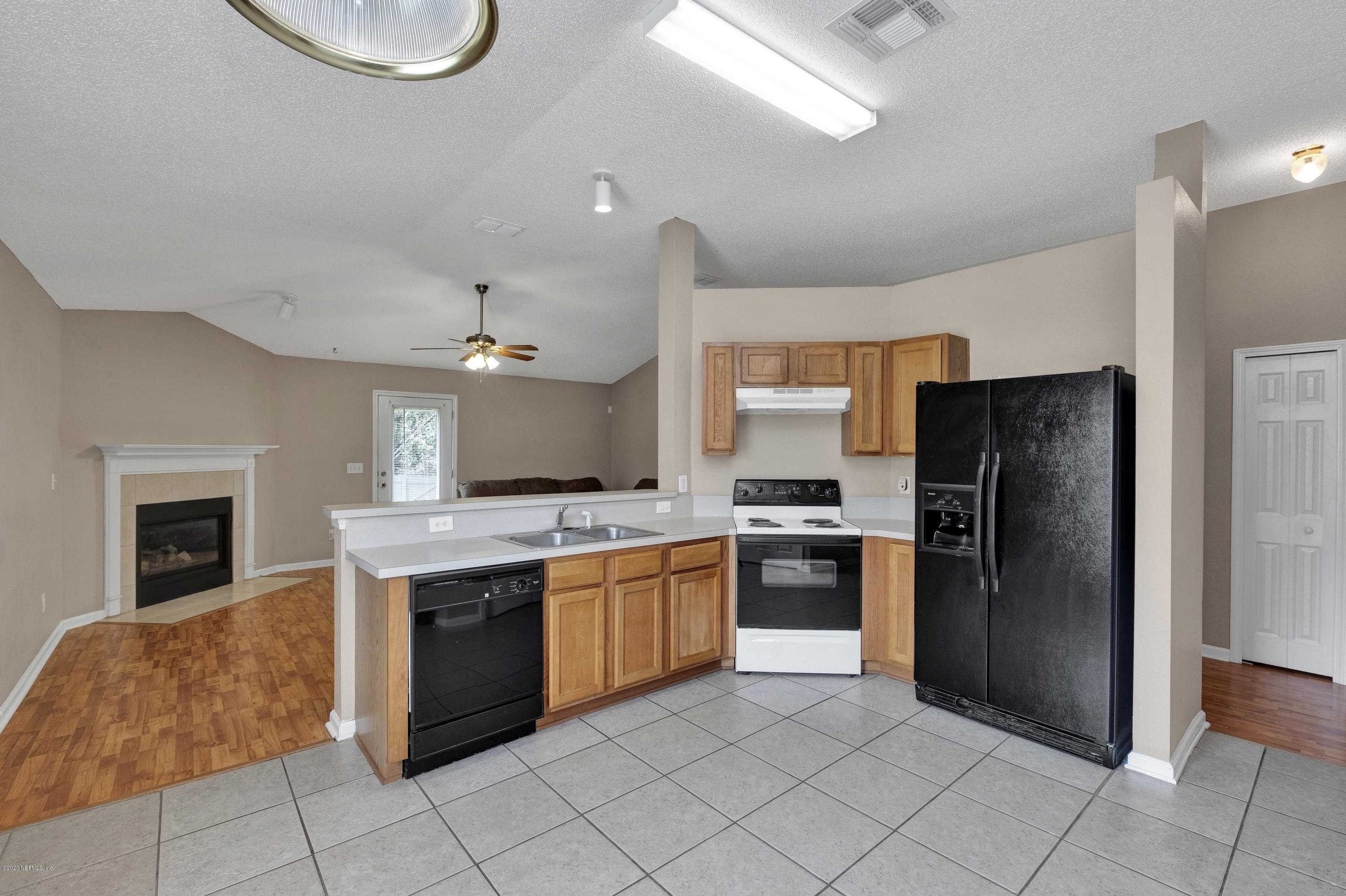 8692 Springtree Road Jacksonville, FL 32210 - Photo 8 of 19 Kitchen overlooks Living