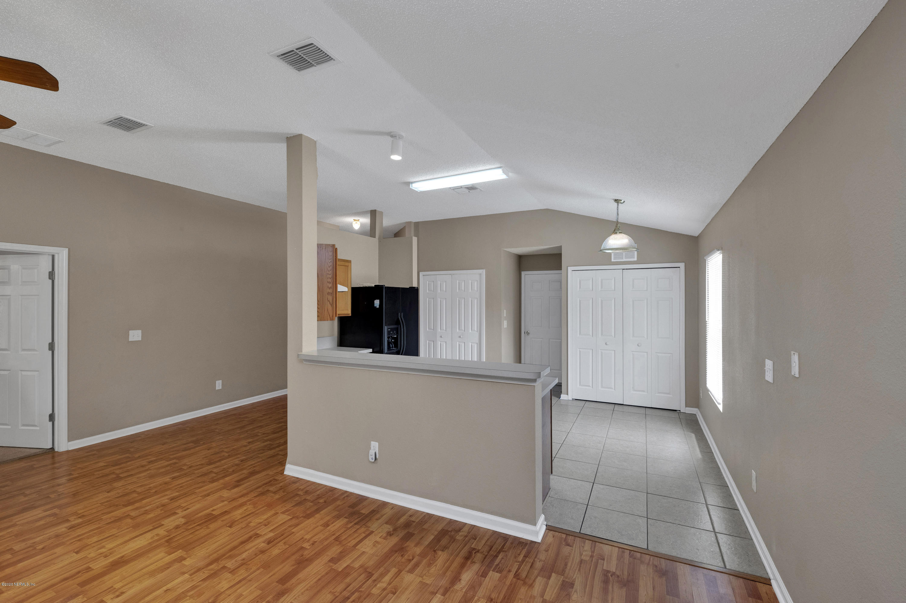 8692 Springtree Road Jacksonville, FL 32210 - Photo 9 of 19 Open Concept Living/Dining/Kitchen