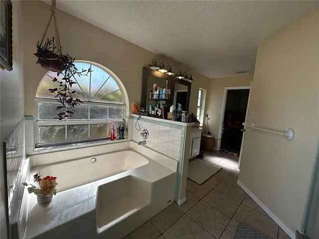 a view of a living room and chandelier