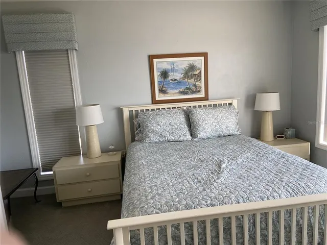 a bedroom with a bed and couch