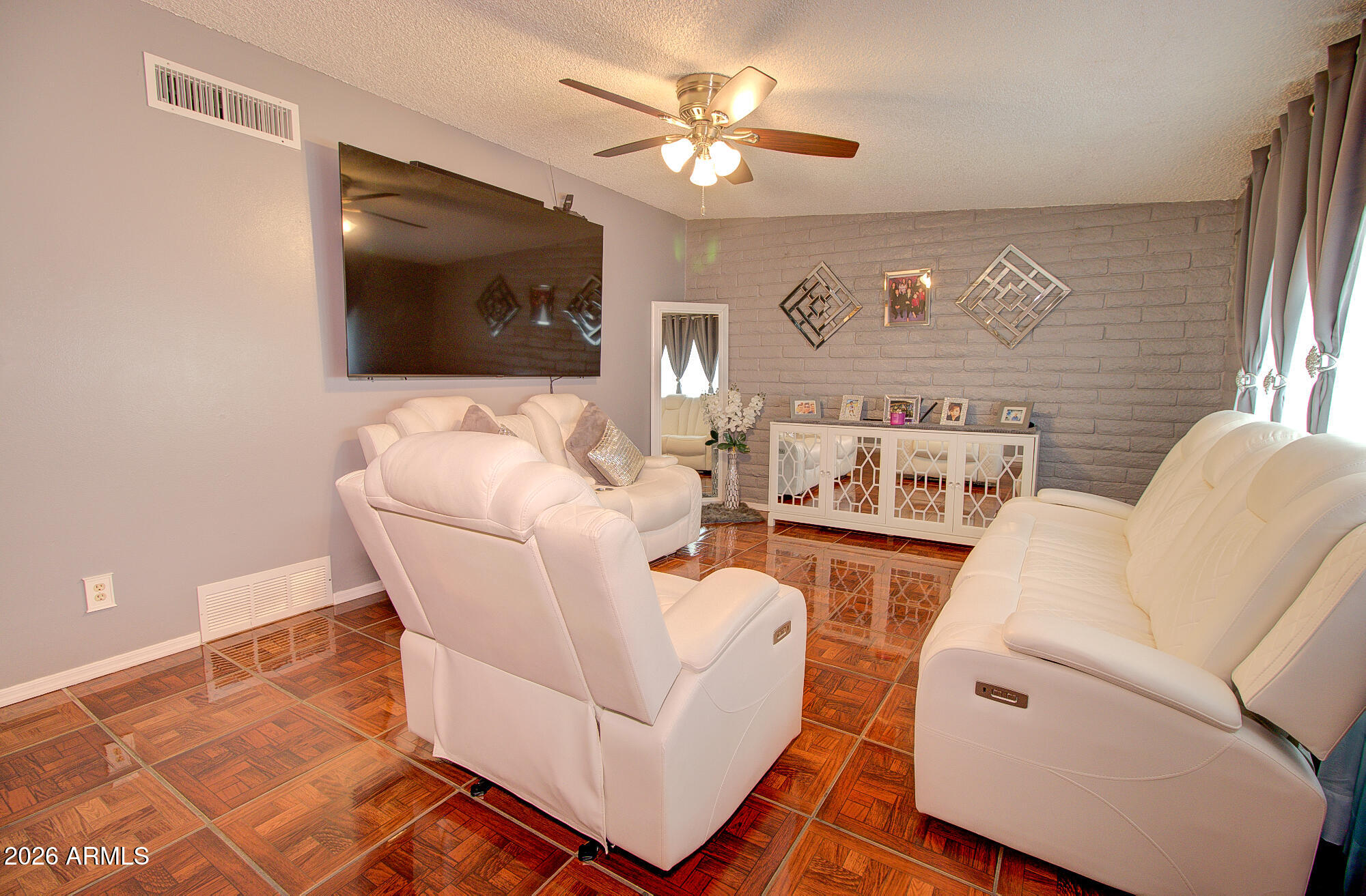 101 East 7th Street Eloy, AZ 85131 - Photo 11 of 34 a living room with furniture and a flat screen tv