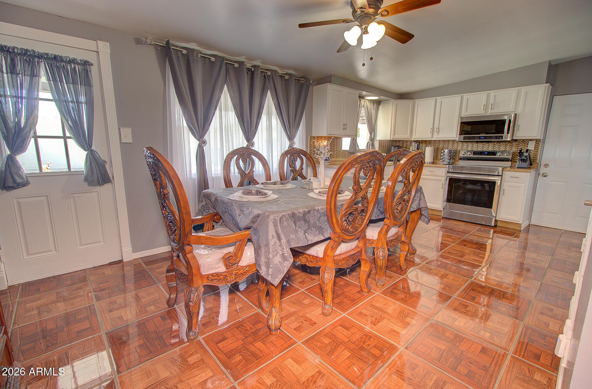 101 East 7th Street Eloy, AZ 85131 - Photo 14 of 34 a view of a dining room with furniture and chandelier