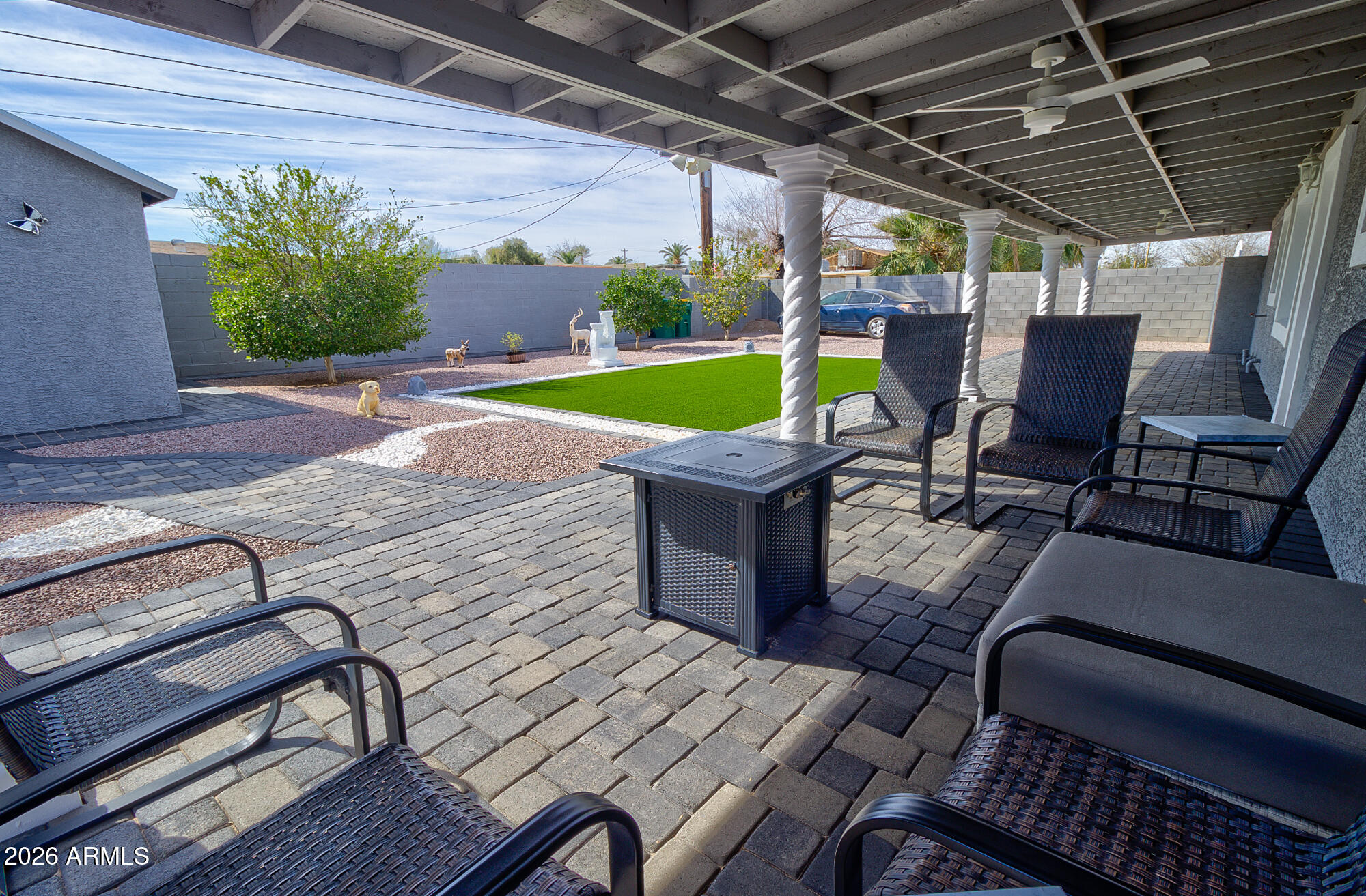 101 East 7th Street Eloy, AZ 85131 - Photo 24 of 34 a view of a patio with table and chairs and potted plants
