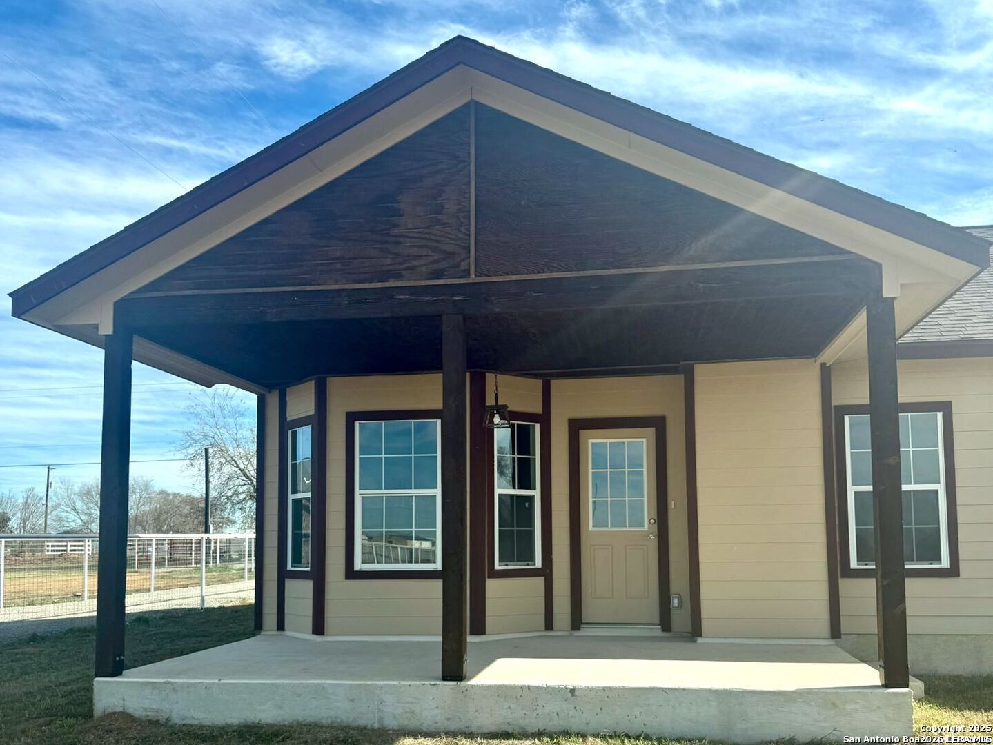14329 Wisdom Road Atascosa, TX 78002 - Photo 5 of 5 a backyard of a house with seating space