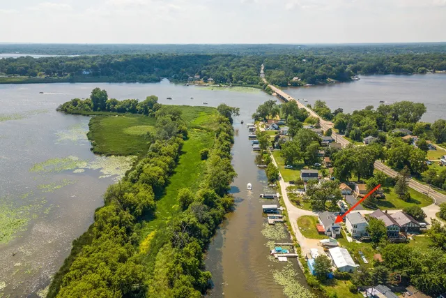 a view of a lake with houses in the back