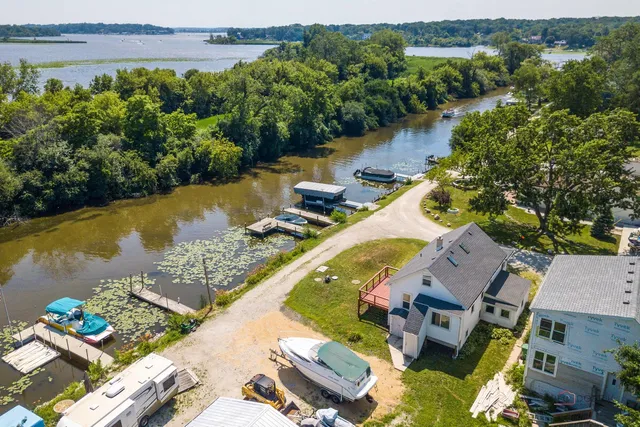 an aerial view of a house with a yard