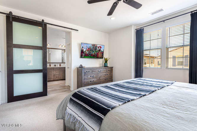 239 Stonegate Road Camarillo, CA 93010 - Photo 11 of 25 a bedroom with a bed and a flat screen tv