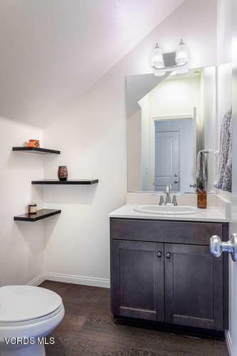 239 Stonegate Road Camarillo, CA 93010 - Photo 8 of 25 a bathroom with a sink a toilet and a mirror