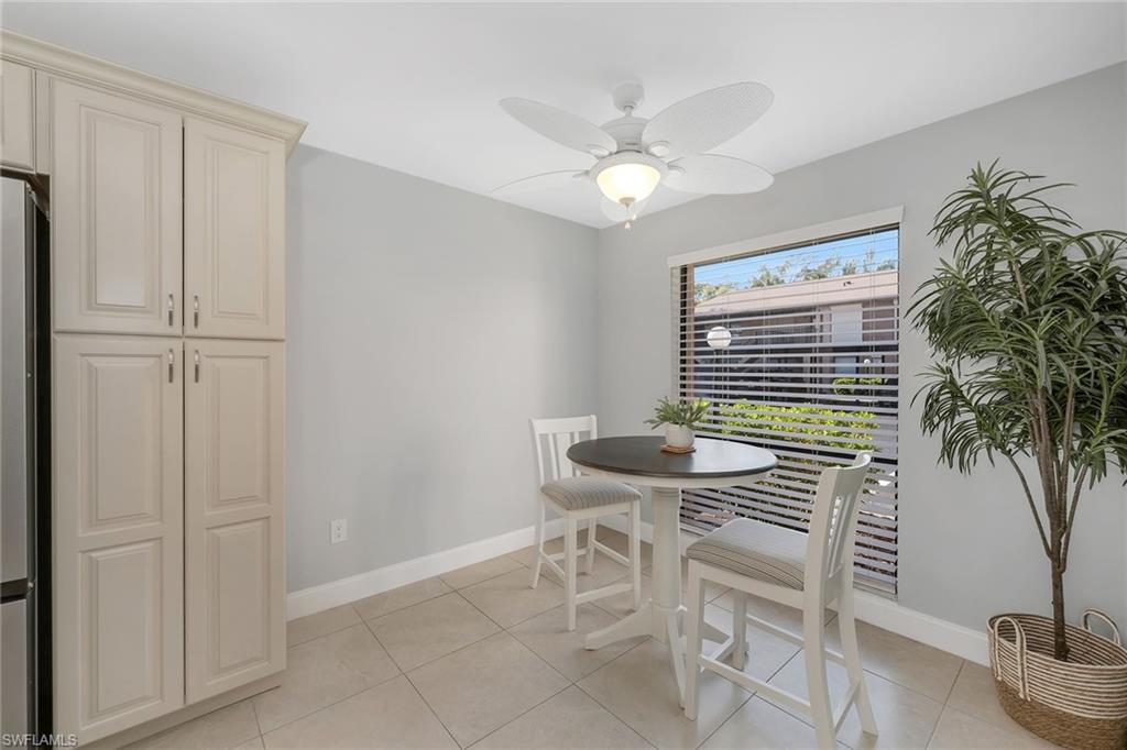 236 Pebble Beach Circle, Unit A102 Naples, FL 34113 - Photo 19 of 40 a view of a livingroom with furniture and window