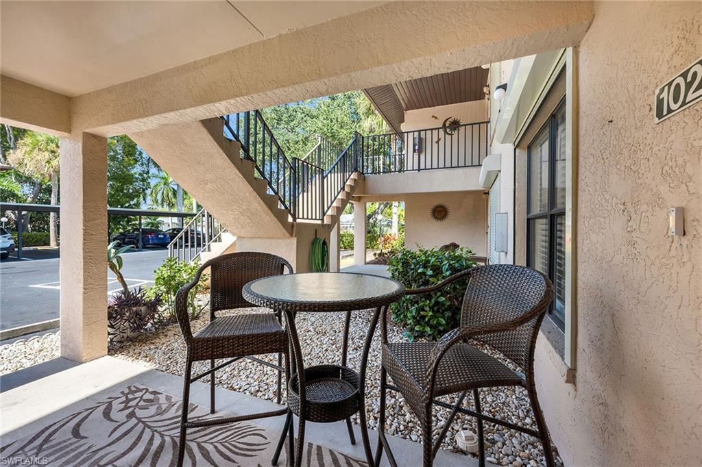 236 Pebble Beach Circle, Unit A102 Naples, FL 34113 - Photo 32 of 40 a view of balcony with furniture and garden