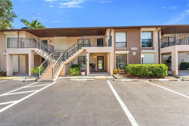 a front view of a building with a road